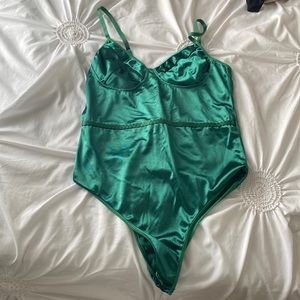 dark green body suit